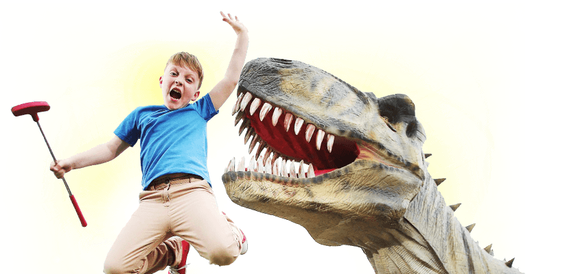 Child playing adventure golf beside a Mighty Adventures dinosaur