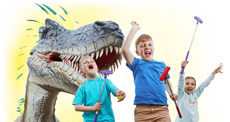 Children playing adventure golf beside a Mighty Adventures dinosaur